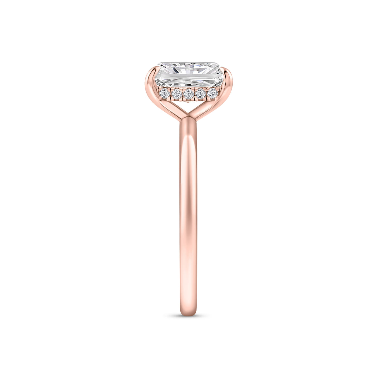 rose gold 3 carat radiant cut hidden halo solitaire engagement ring on a white background