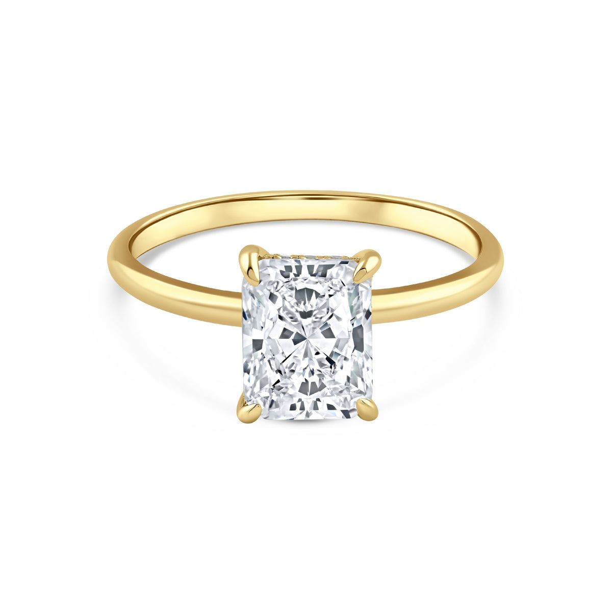 gold 3 carat radiant cut hidden halo solitaire engagement ring on a white background