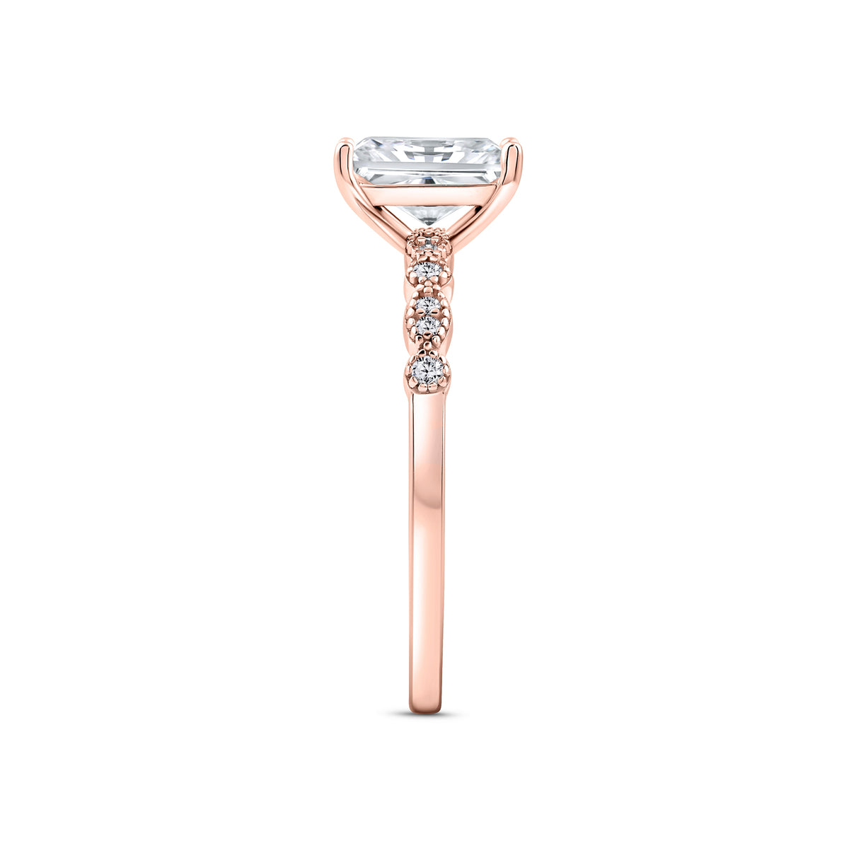 rose gold 1.5 carat radiant cut vintage-inspired engagement ring on a white background