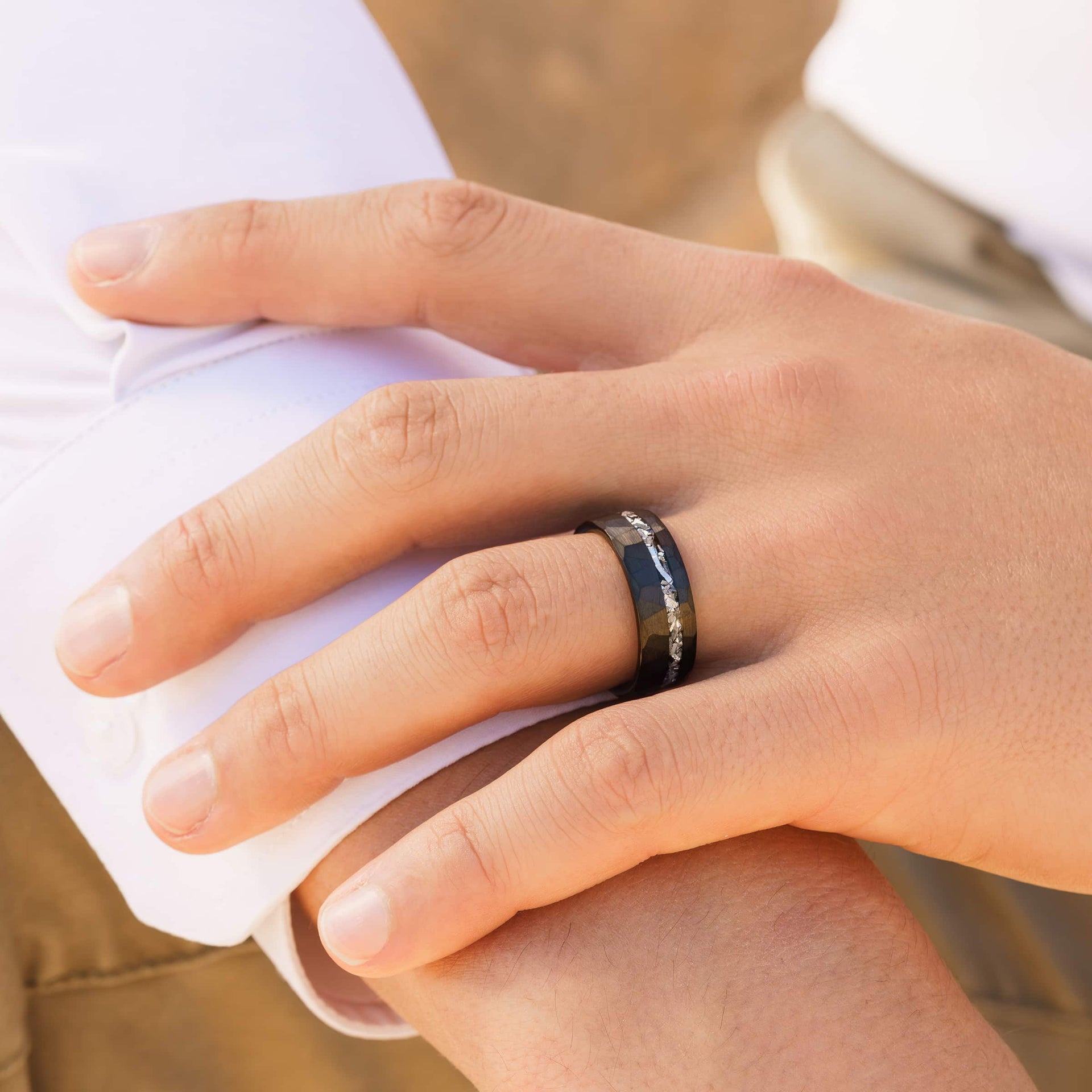 man wearing black eclipse wedding ring