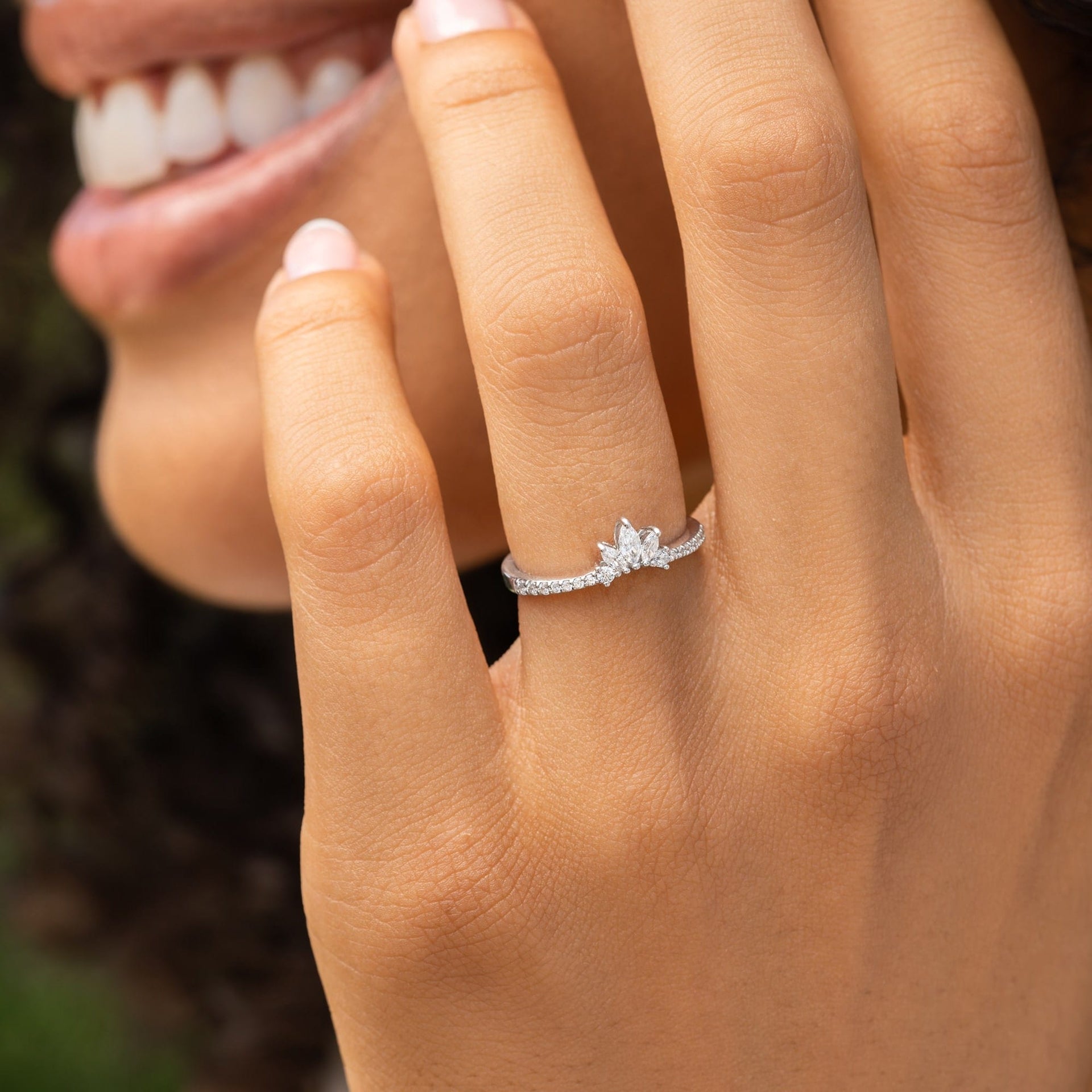 Girl smiling while wearing dainty vintage wedding band