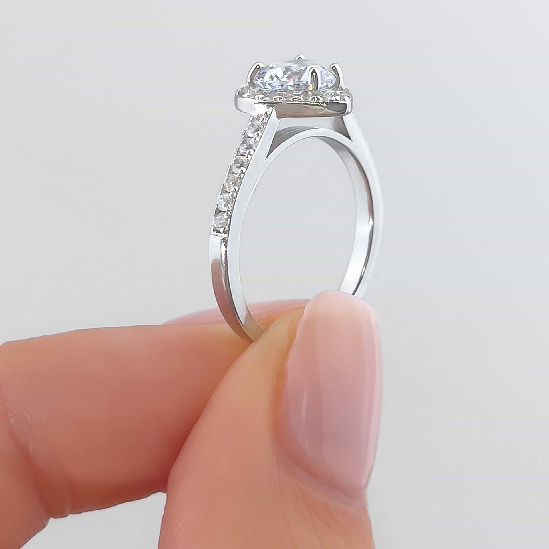 gorgeous silver halo setting shot sweetheart engagement ring