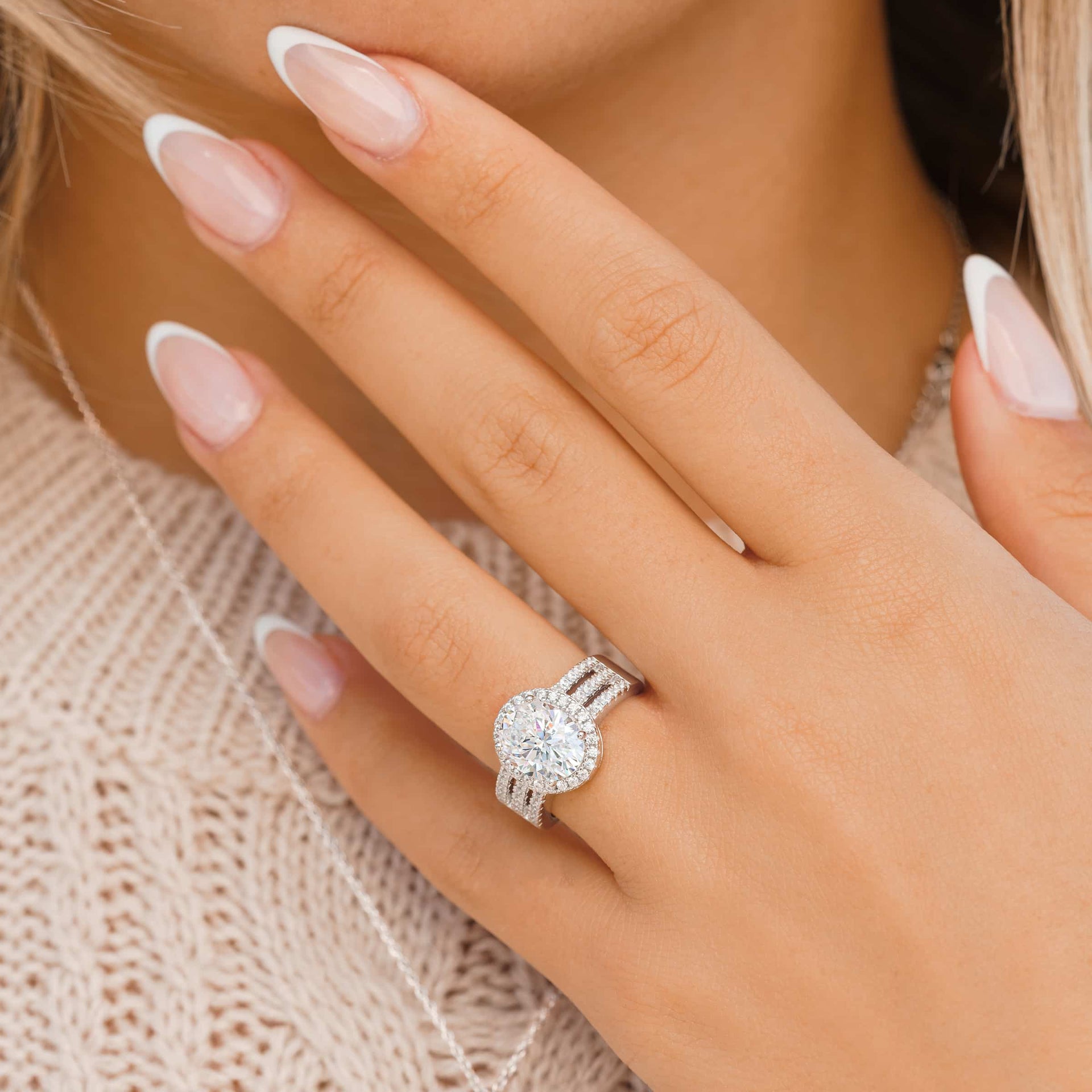 silver queen engagement ring on ladies hand