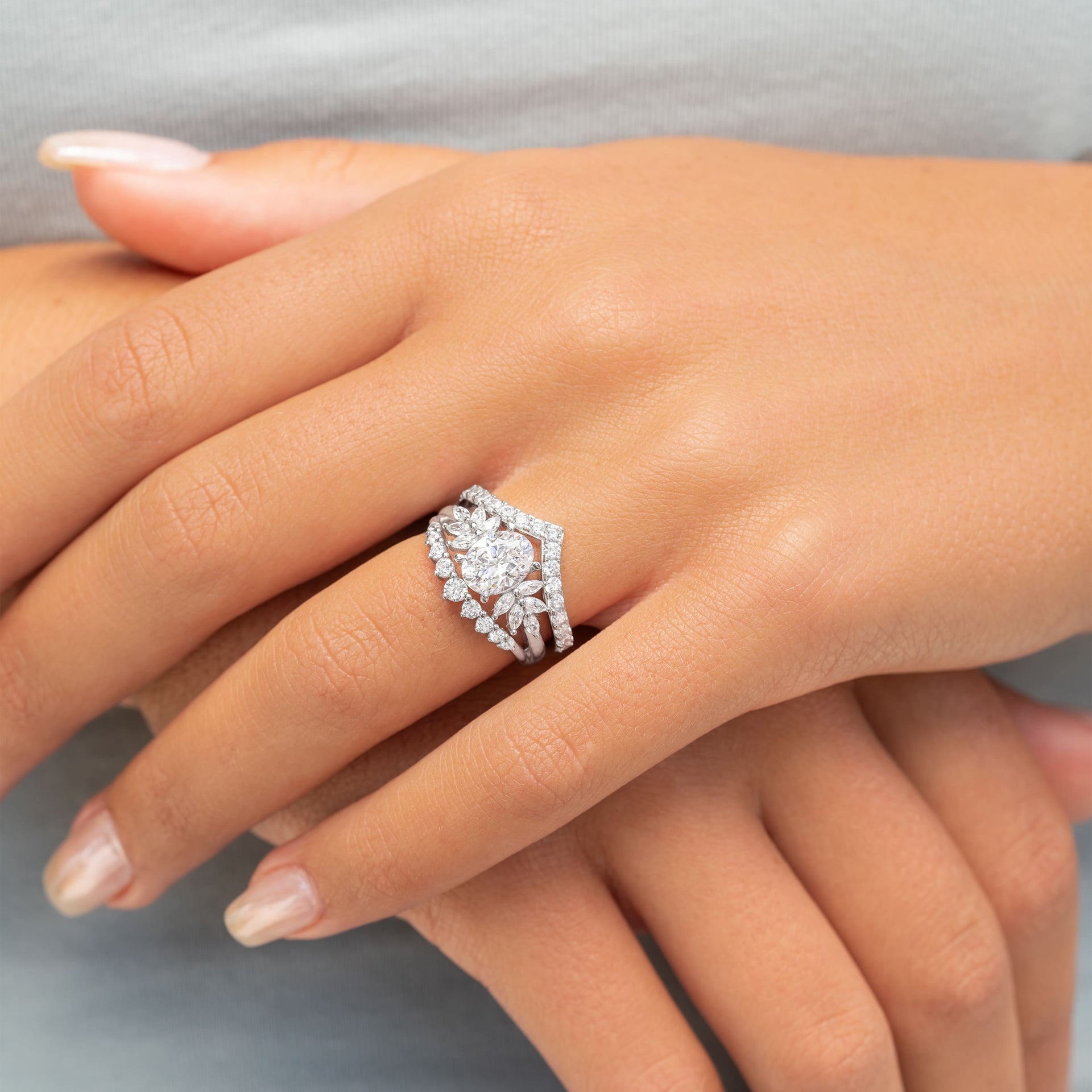 woman wearing silver vintage engagement ring on hand