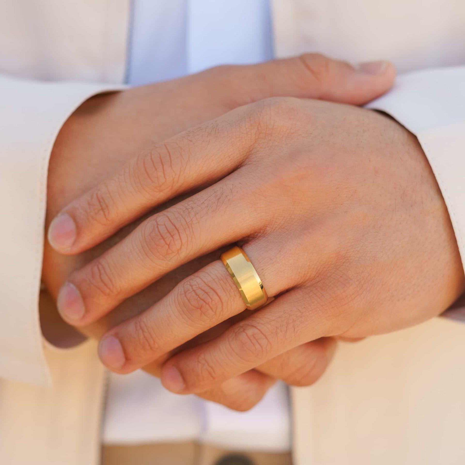 man wearing gold wedding band on finger called the titan