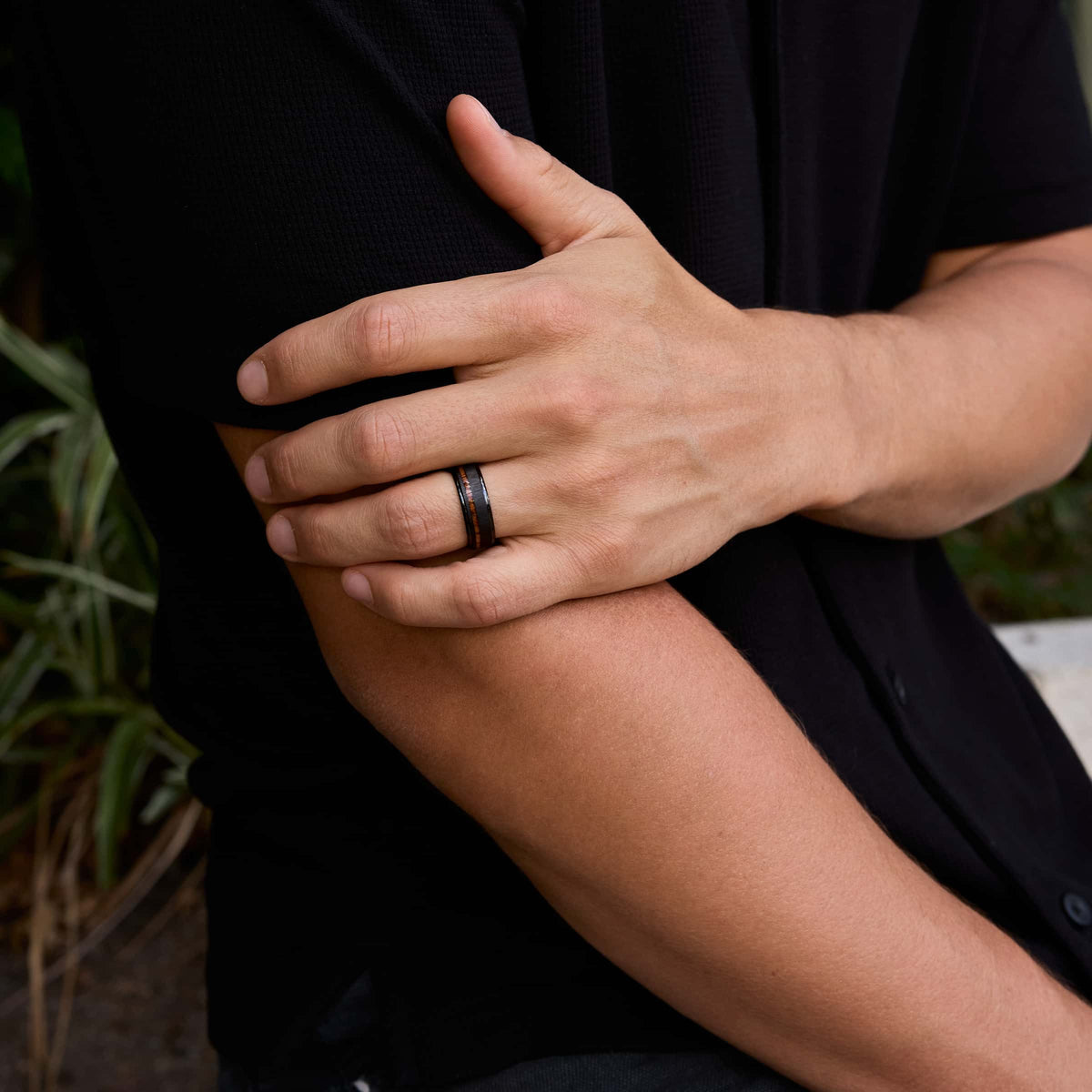 8mm tungsten carbide band on model in black shirt