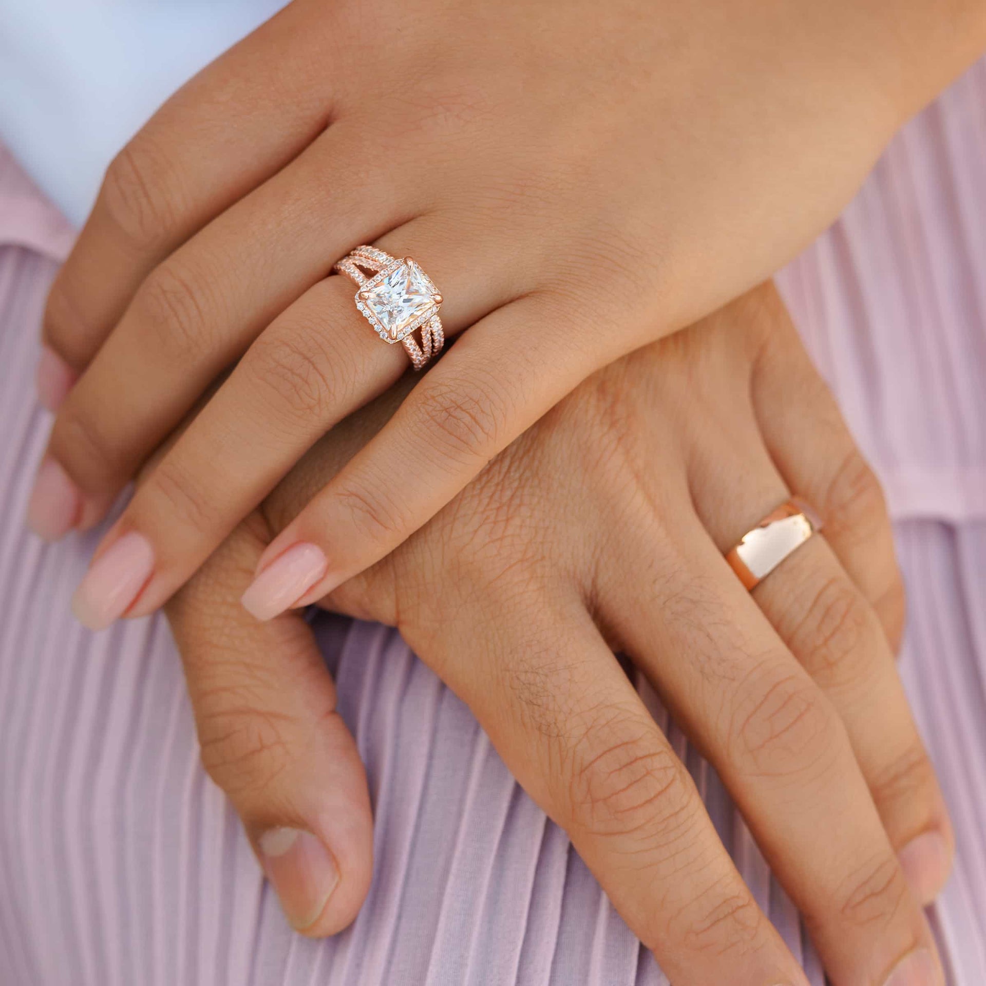stunning rose gold affordable men's horizon wedding band and rose gold radiant cut wedding ring set shown on couple's hands