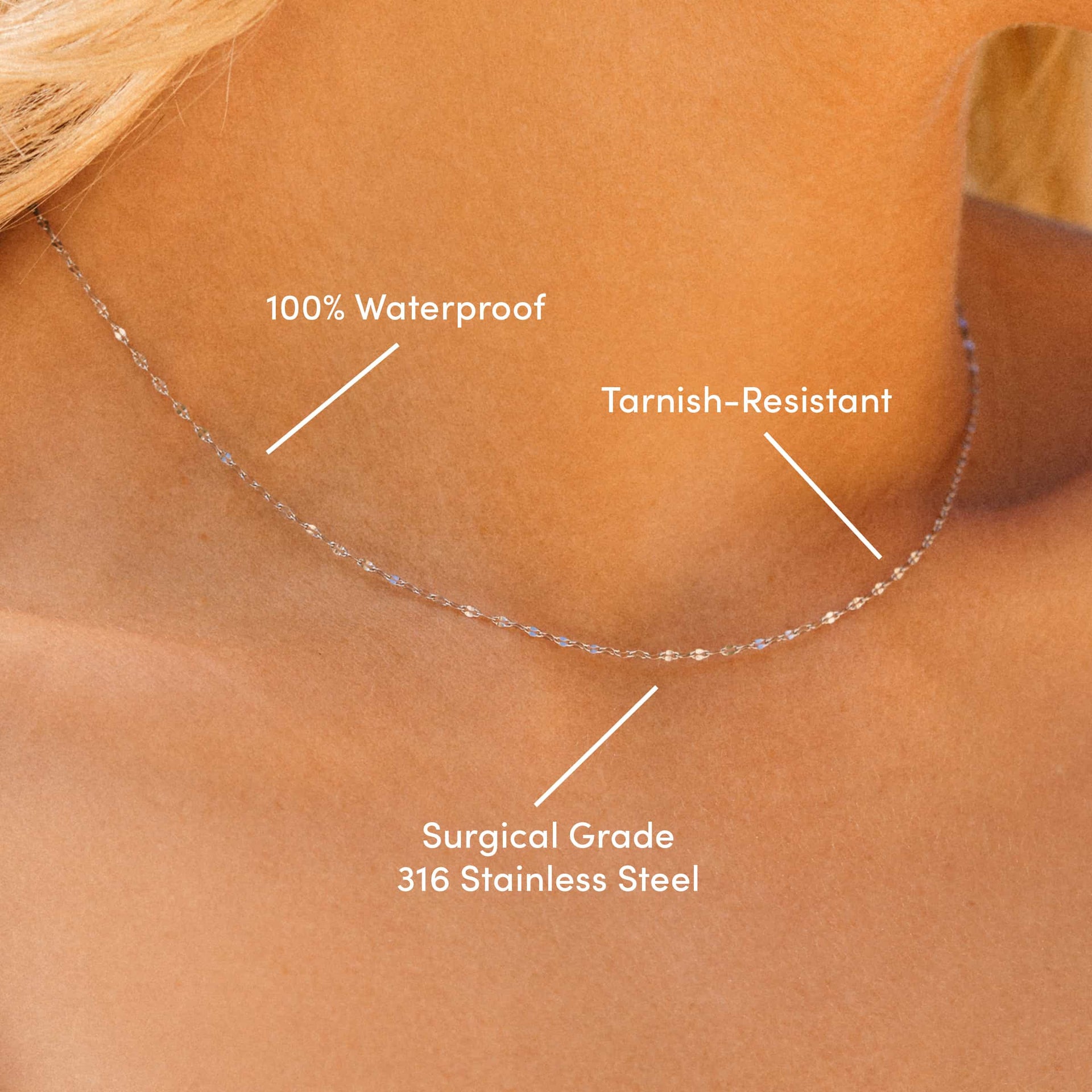 close up of a dainty stainless steel diamond cut lip chain necklace with the overlayed text: "100% Waterproof, Tarnish-Resistant, & Surgical Grade 316 Stainless Steel"