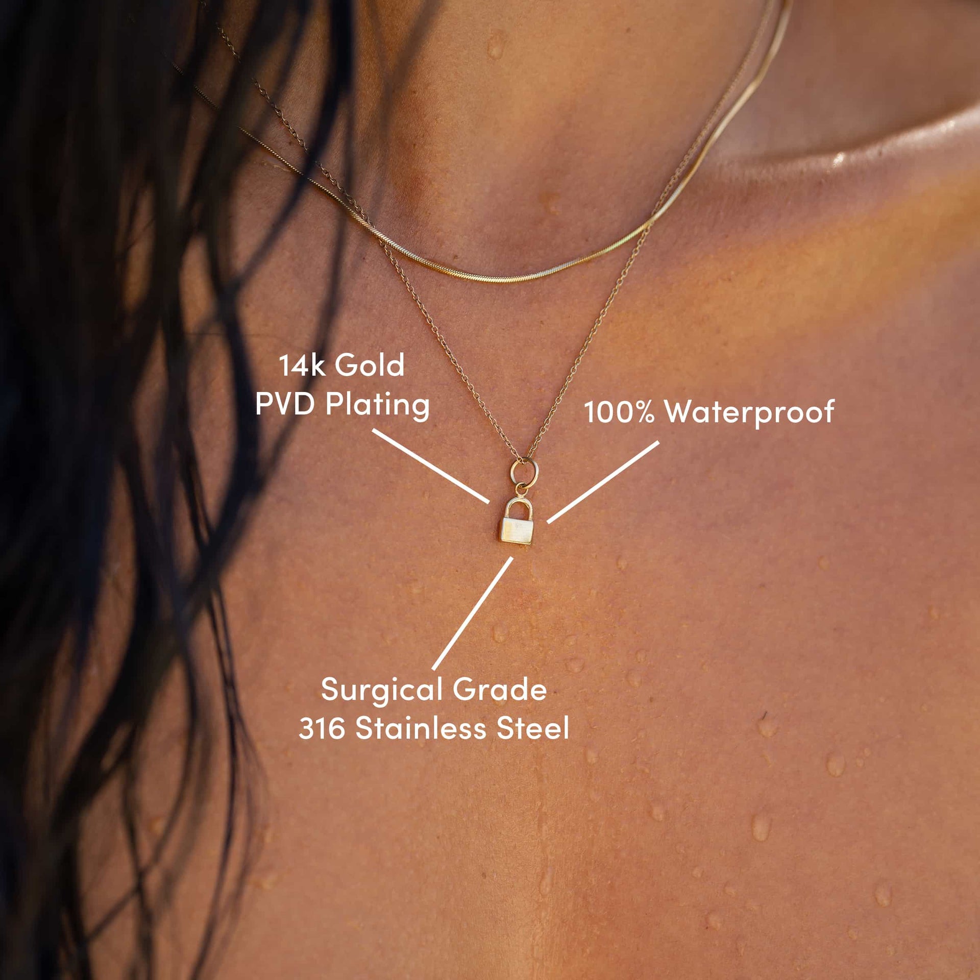 Gold Lock Charm on simple cable chain necklace & layered with a snake chain necklace with the text overlayed "14k gold PVD plating, 100% waterproof, surgical grade 316 stainless steel"