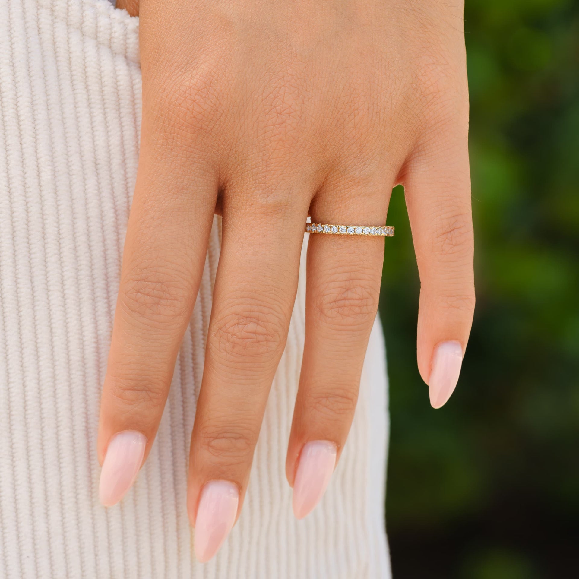 woman wearing gold elegant wedding band