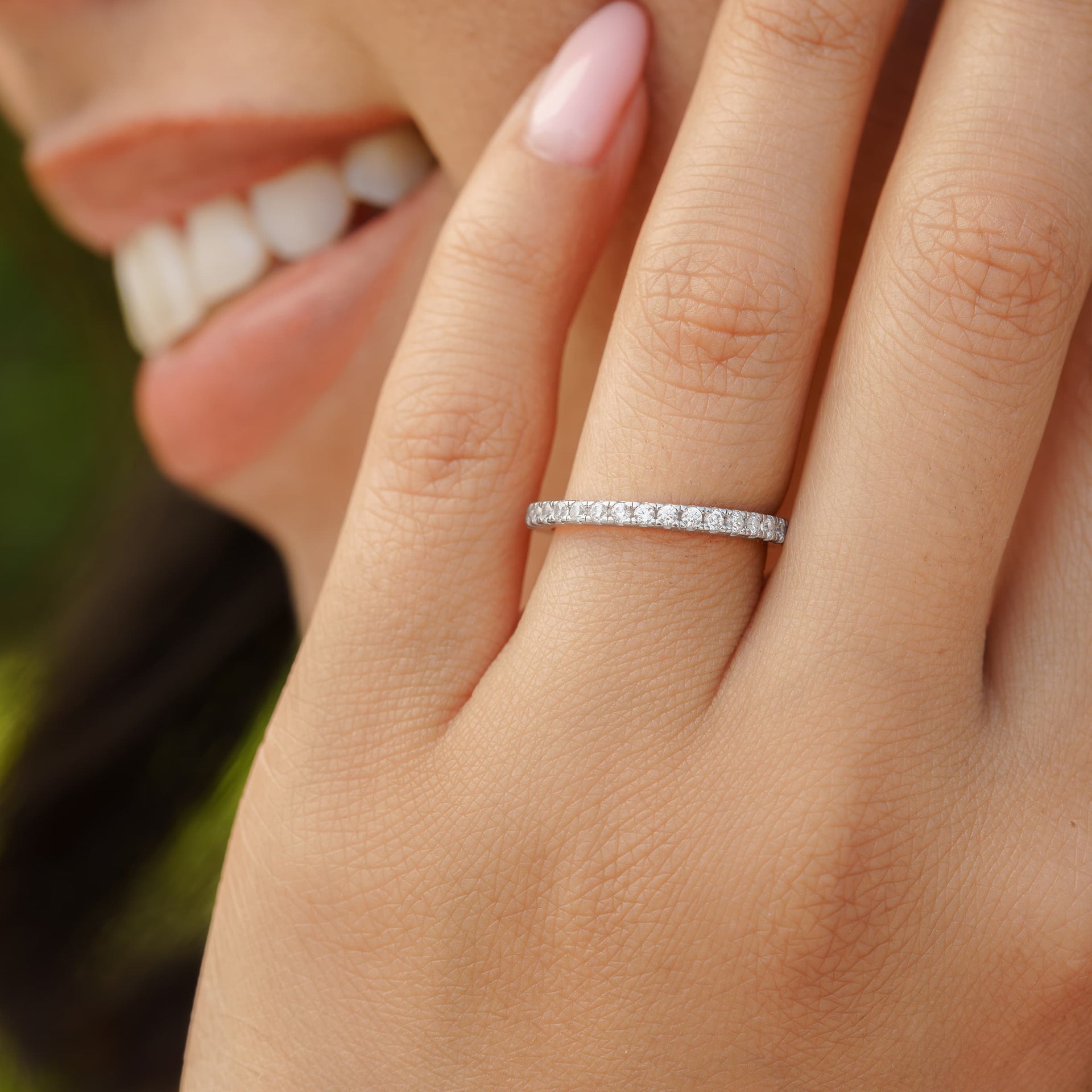 woman wearing silver elegant wedding band