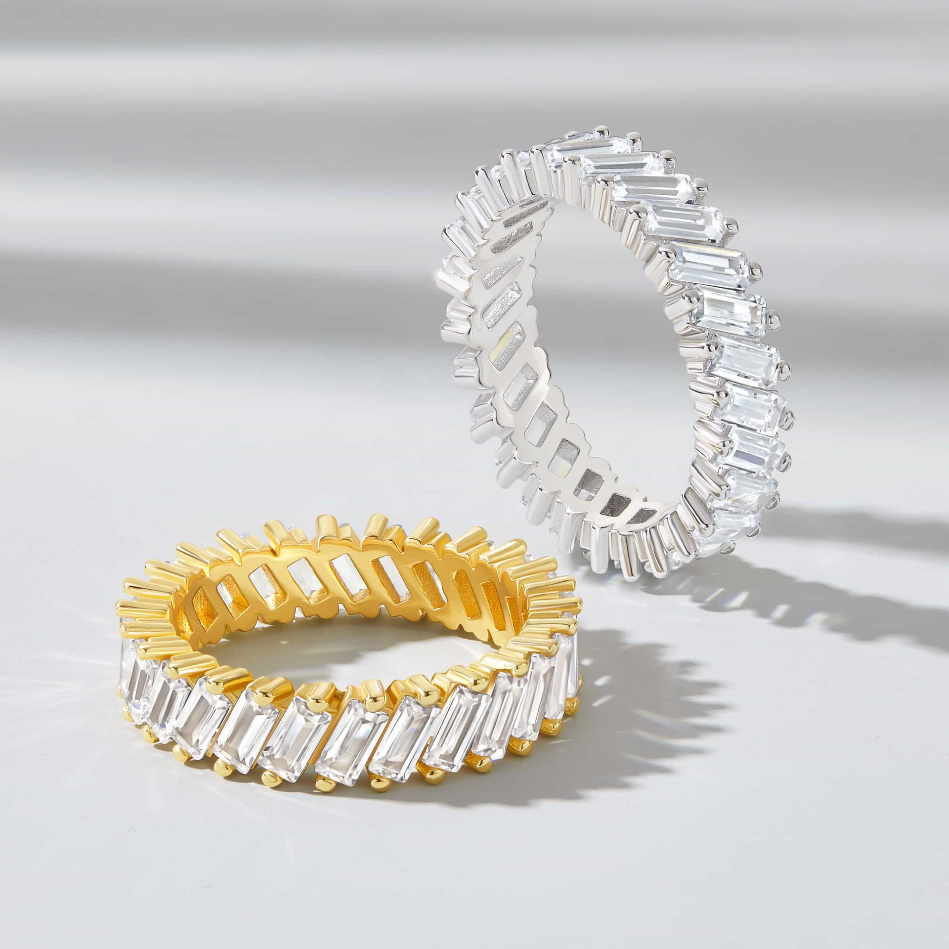 flatlay showing gold and silver artemis wedding band