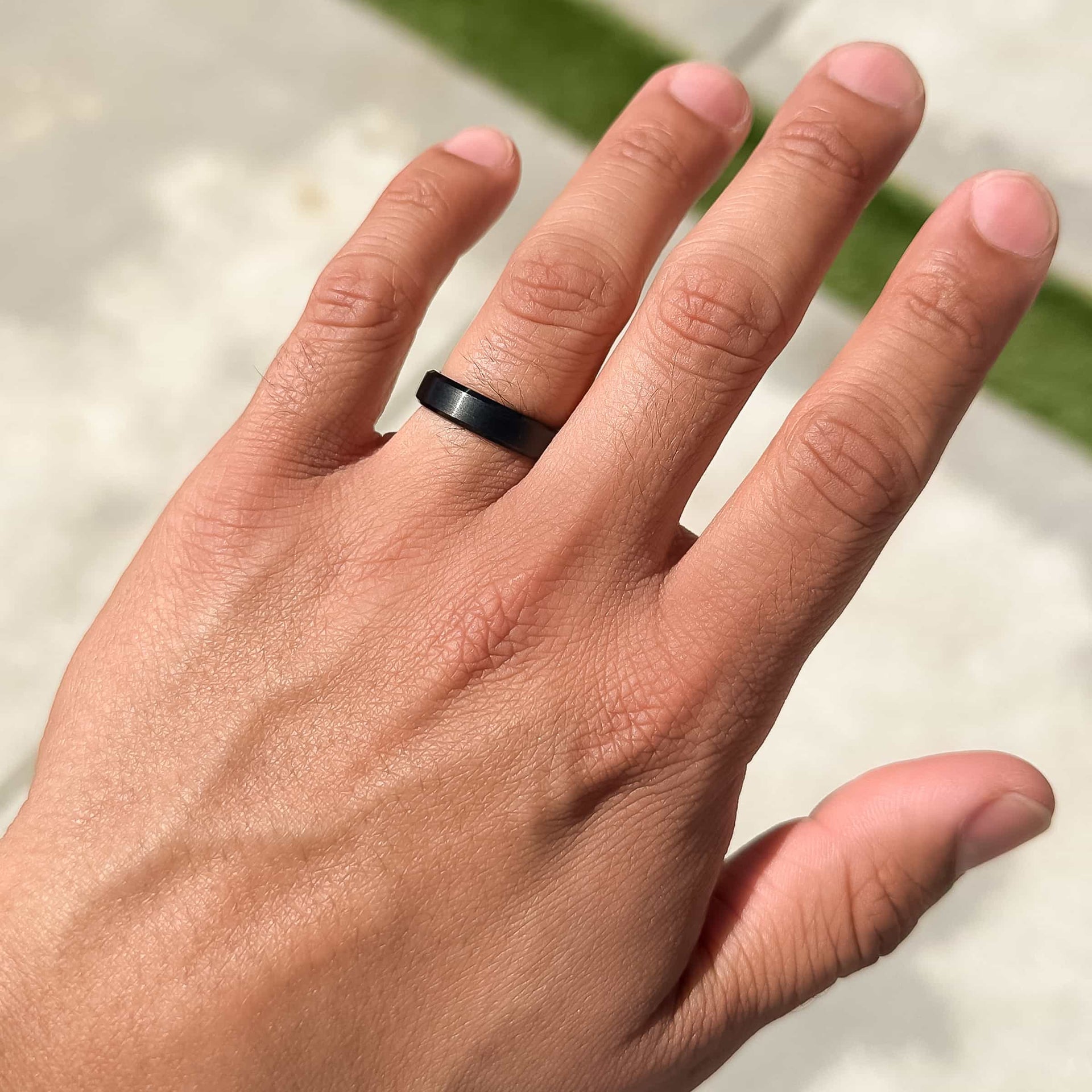 black titanium infinity wedding band on male model