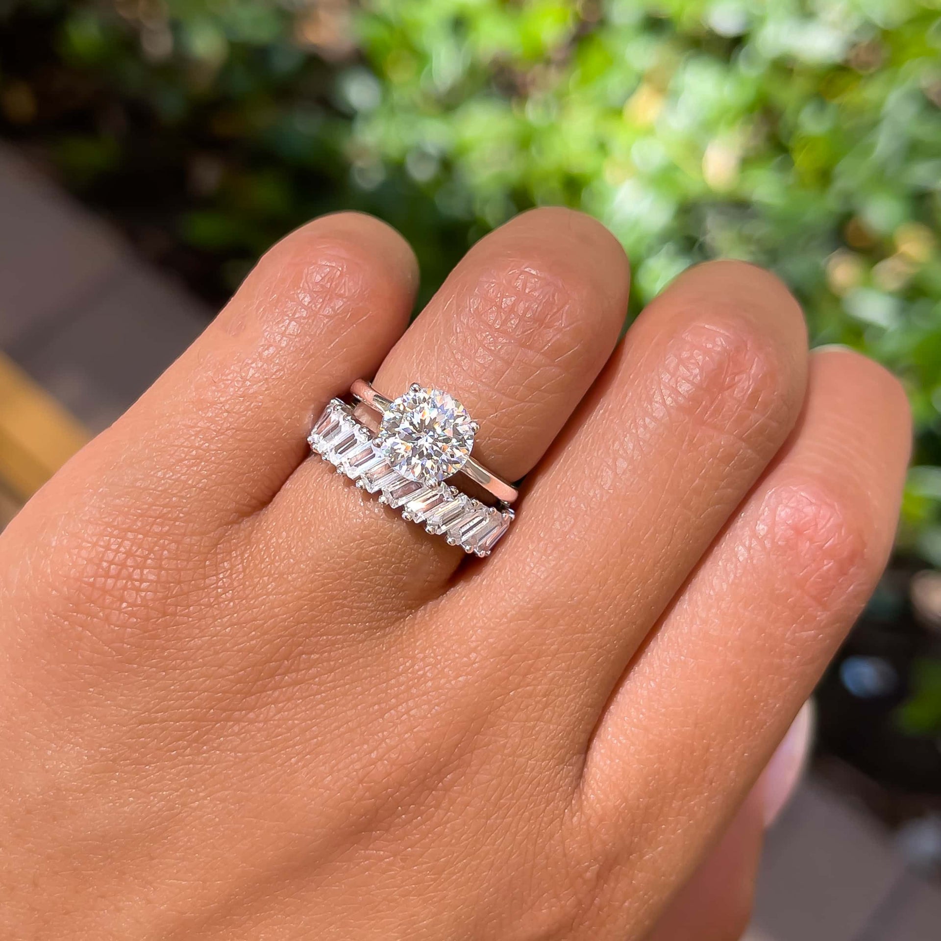 classic silver round cut solitaire engagement ring paired with silver baguette band