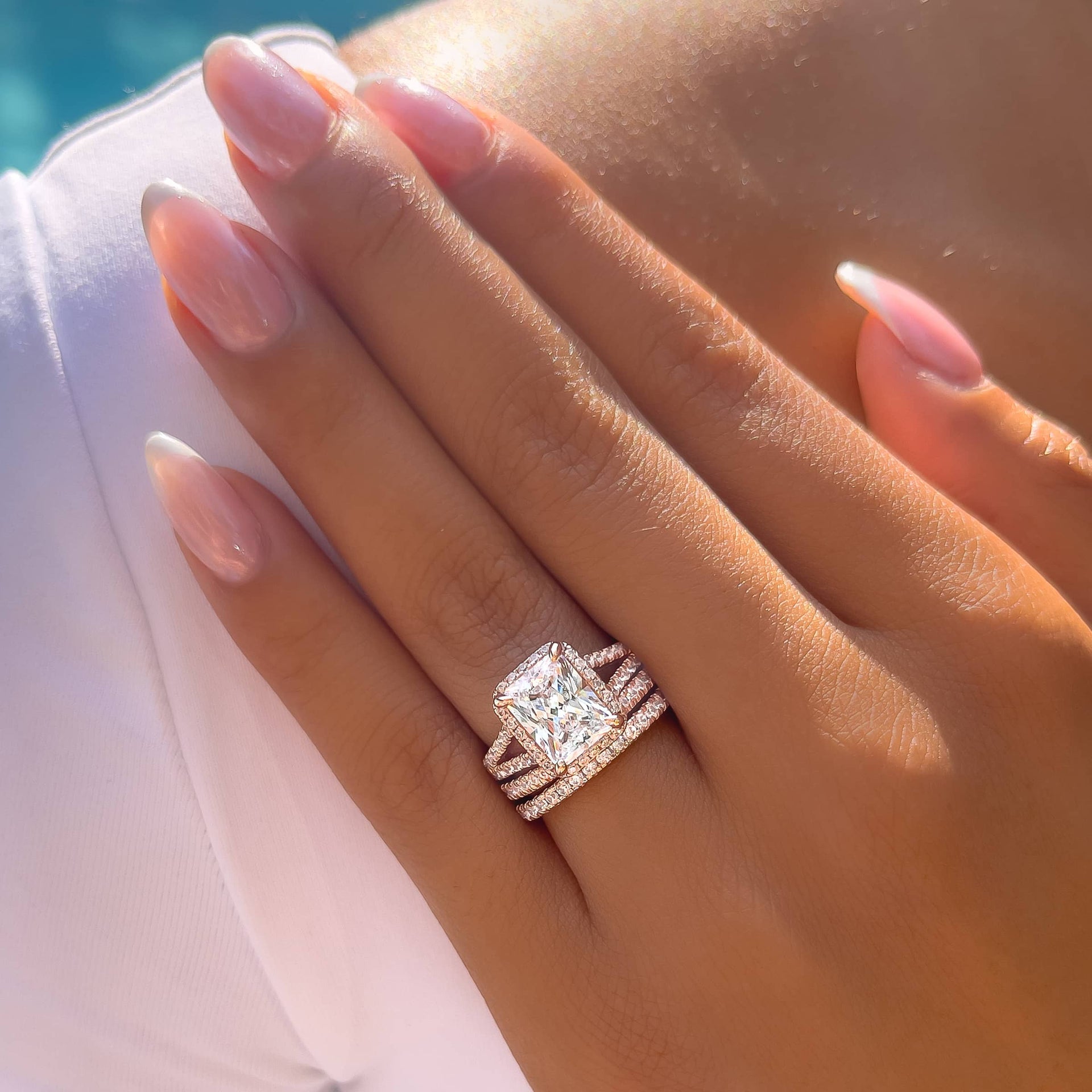 triple stack radiant cut engagement ring on models hand