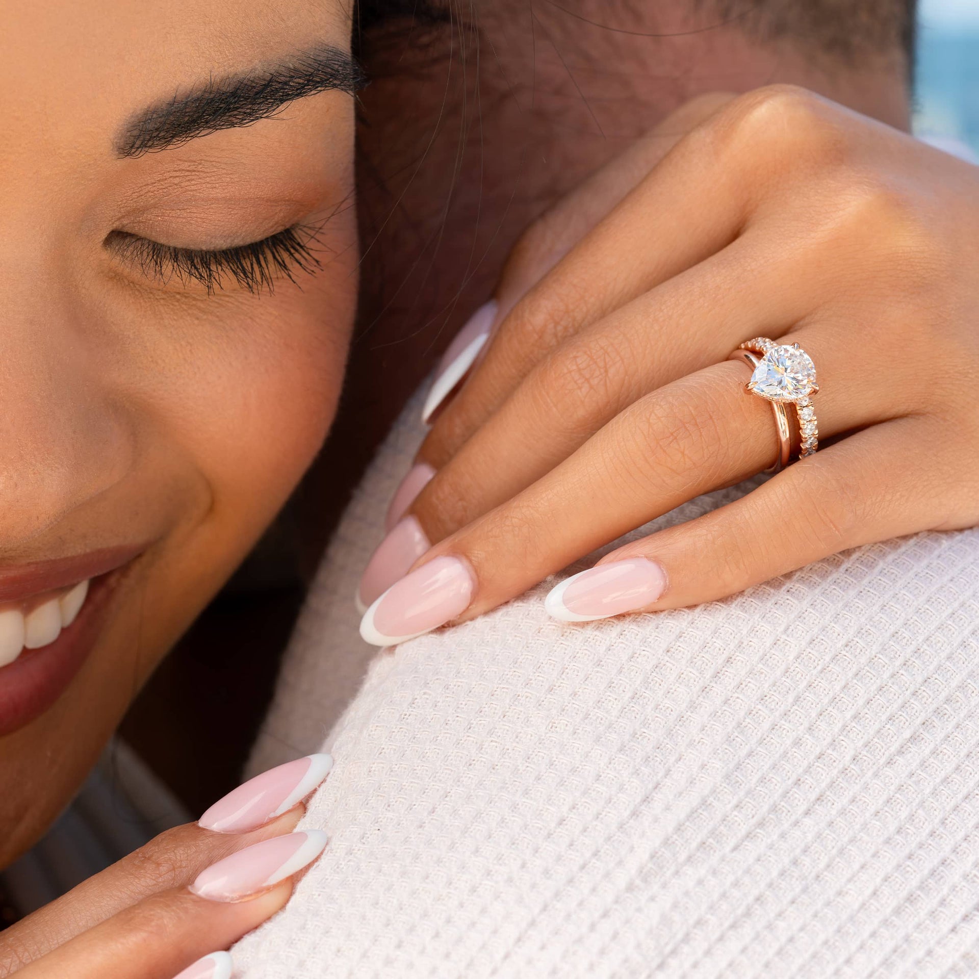 Female hand wearing Kira rose gold engagement ring