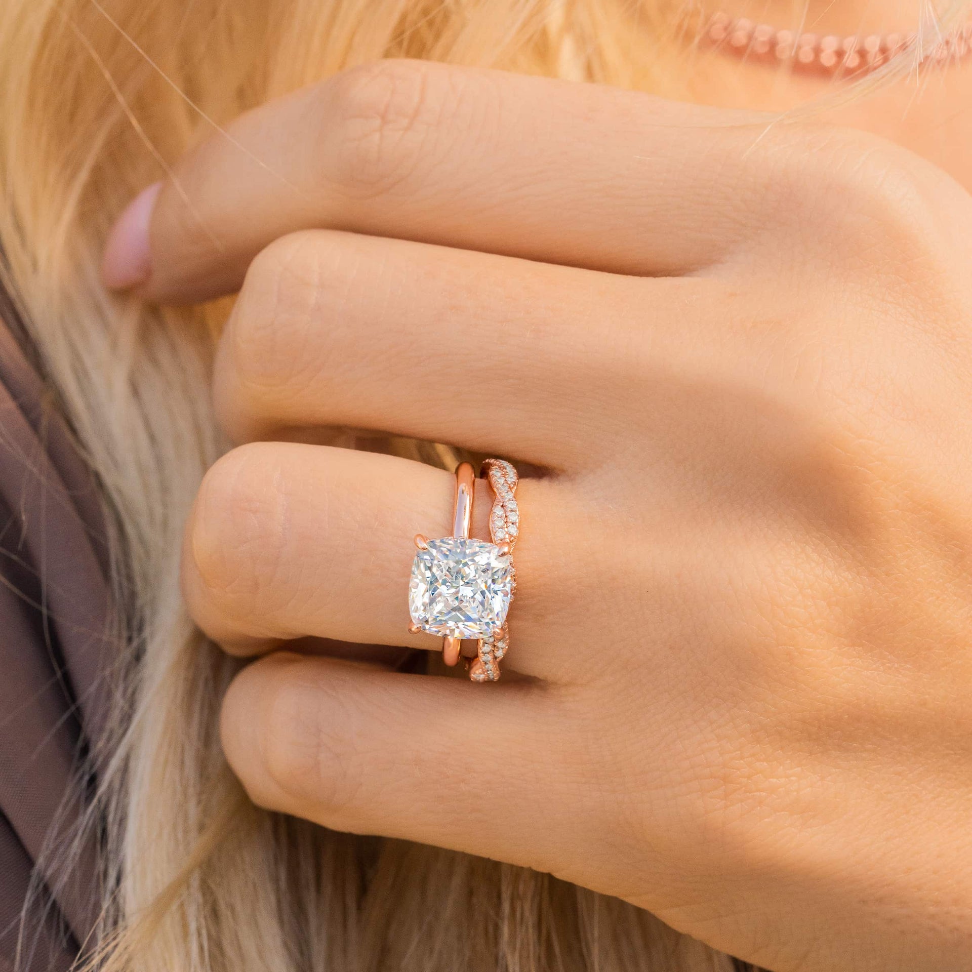 woman wearing rose gold sadie wedding band