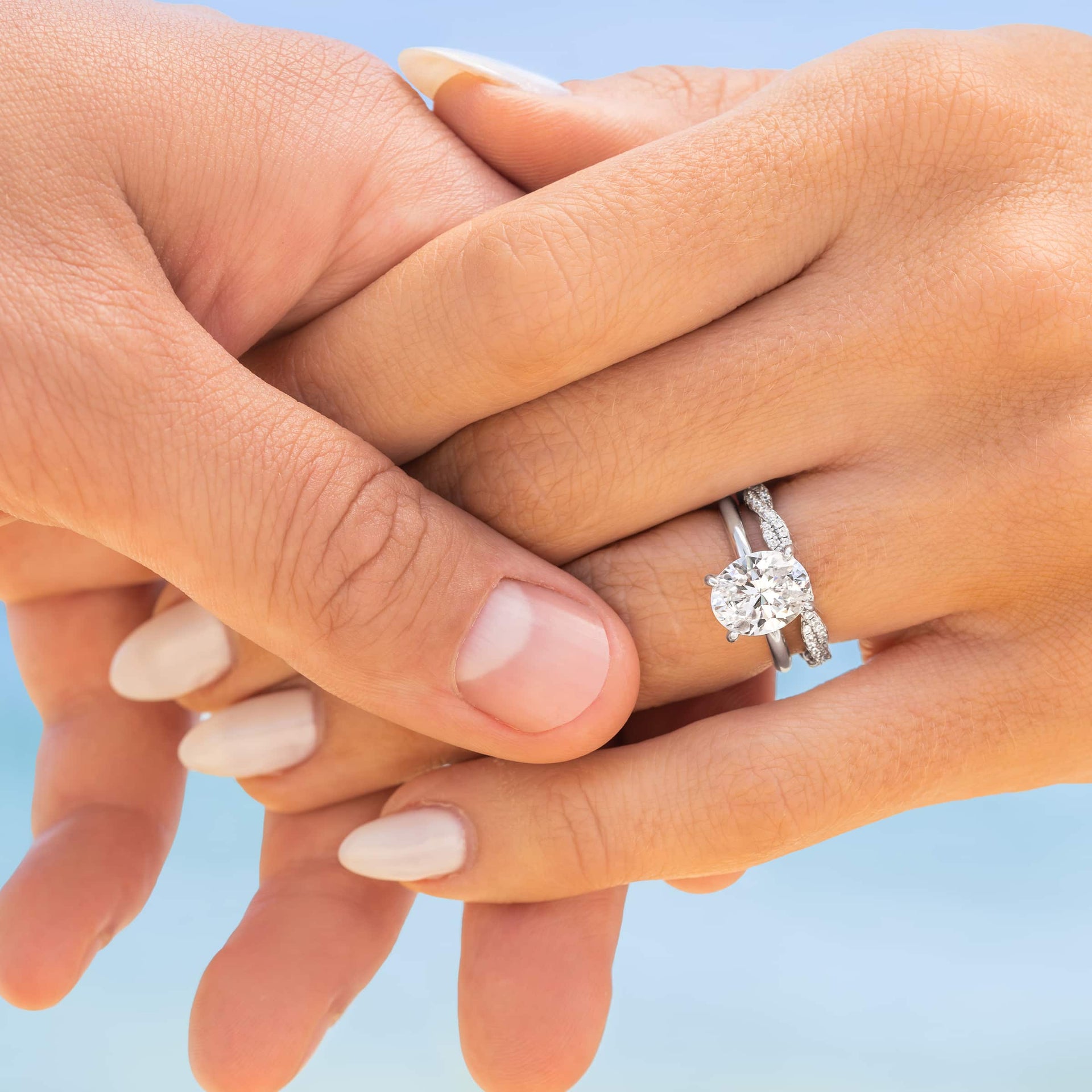 woman wearing sadie wedding band in silver with the elena engagement ring