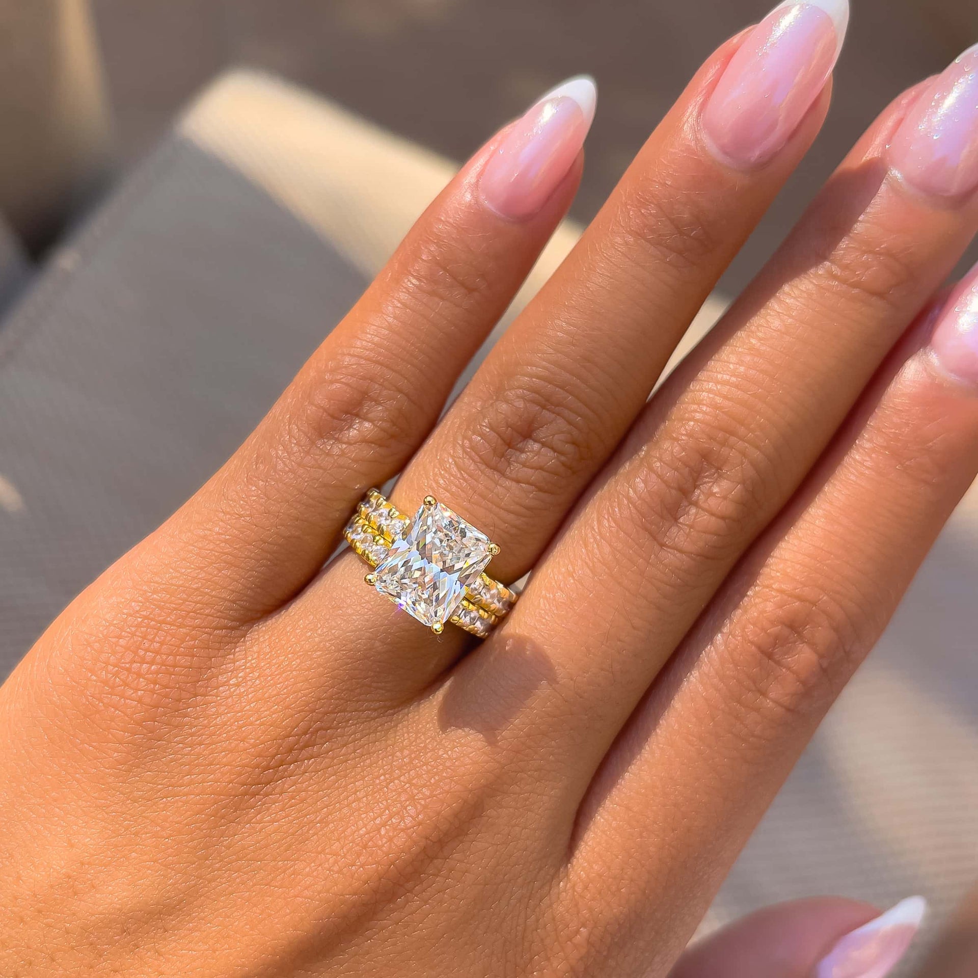 gorgeous 3.75 carat gold radiant cut wedding ring set on model with french tip nails