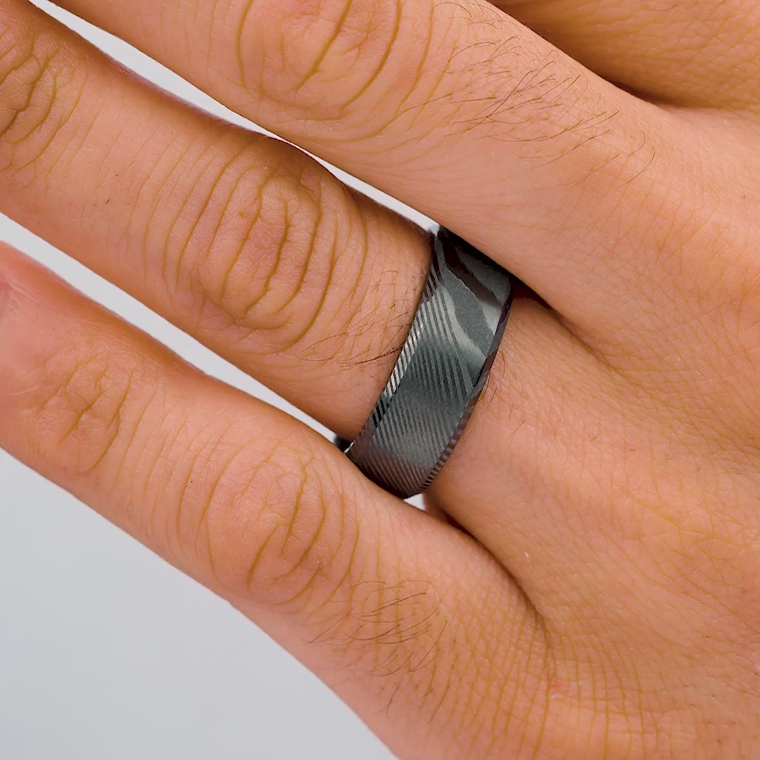 video showcasing a slate colored mens maverick wedding band on model's hand