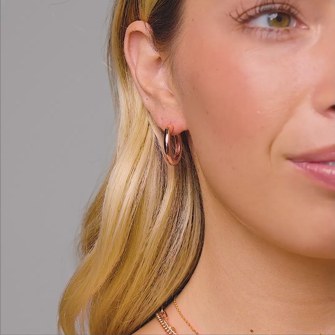 bold rose gold hoops on model