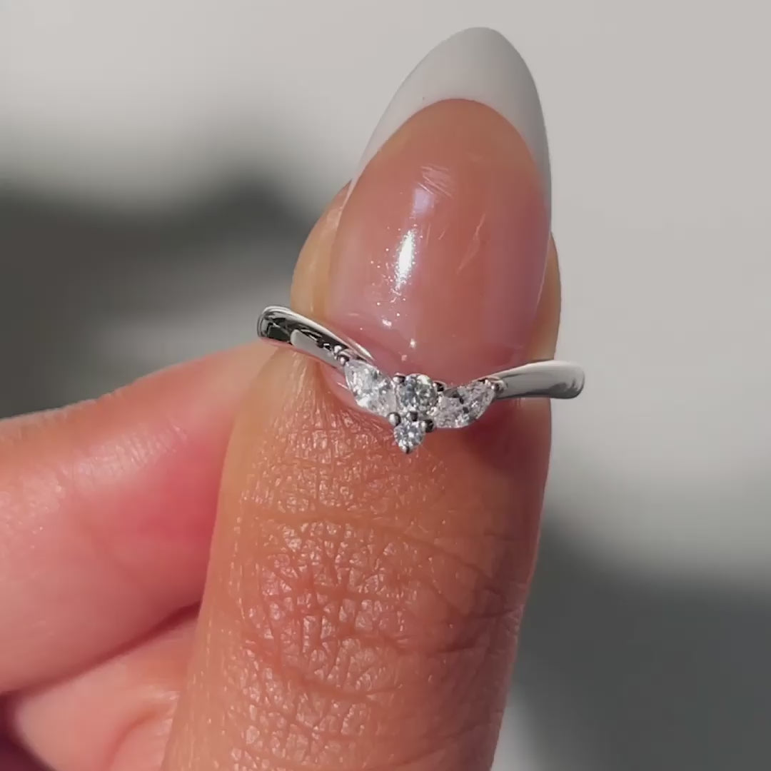 video of silver simple vintage chevron wedding band on model with french tip nails