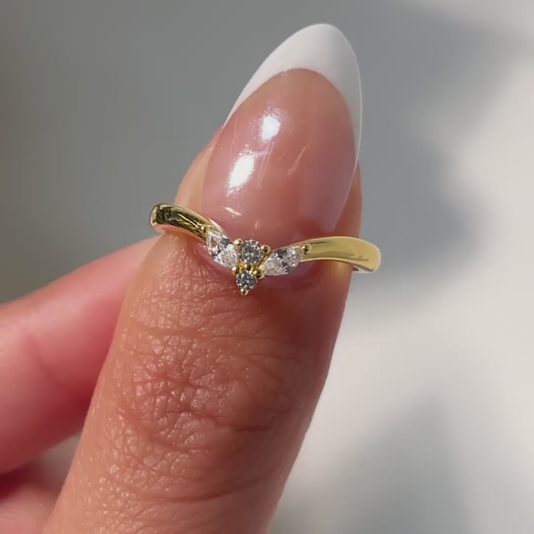 video of gold simple vintage chevron wedding band on model with french tip nails