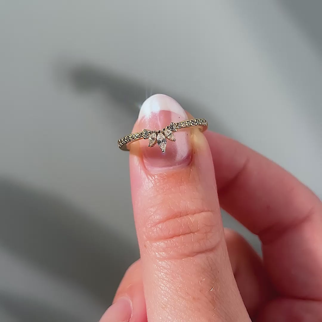 Dainty gold vintage half eternity wedding band shown my female model