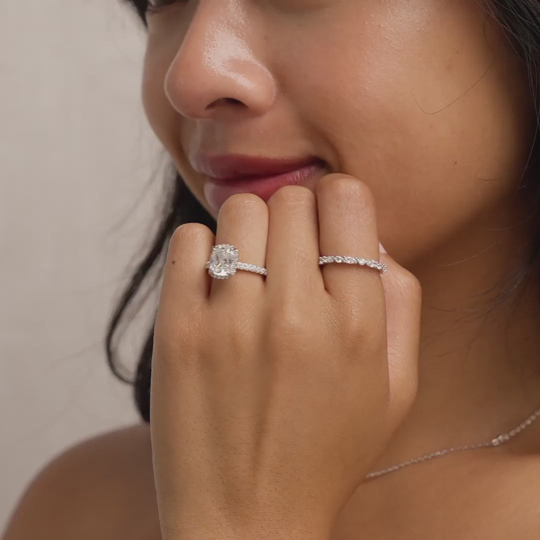 video of silver 3 carat elongated cushion cut halo engagement ring on model