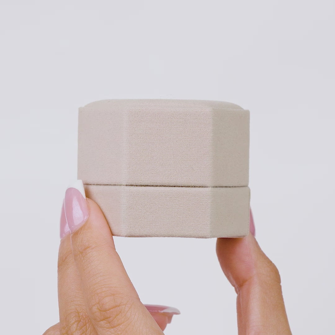 gorgeous hex ring boxes with beautiful engagement rings in the inside