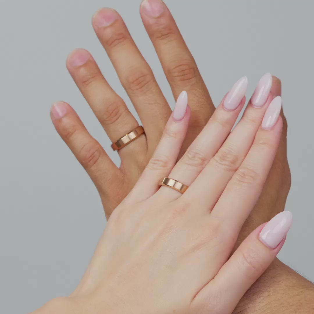 video of male and female model wearing a rose gold slim 5mm stainless steel unisex band