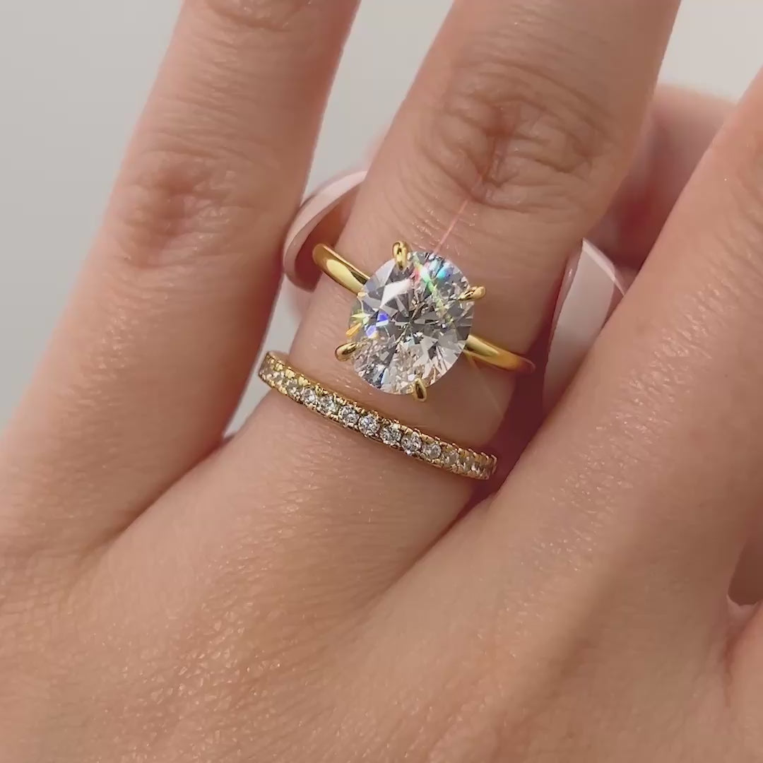 video of classic gold 3 carat oval cut wedding ring set shown on model