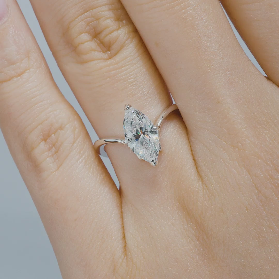 video of silver 2 carat marquise solitaire chevron engagement ring on a model