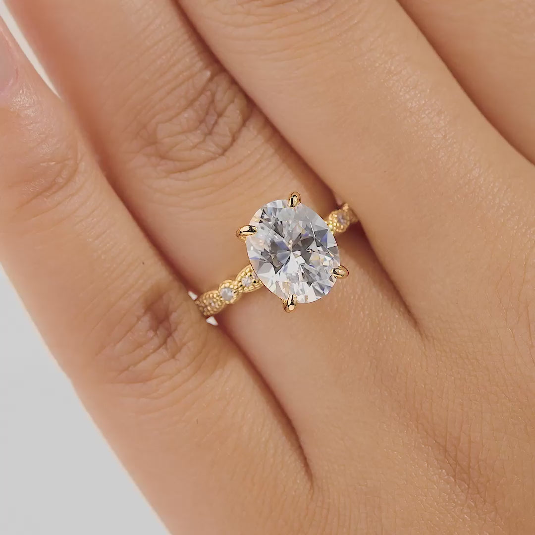 Video of gold 3 carat oval cut engagement ring on female model