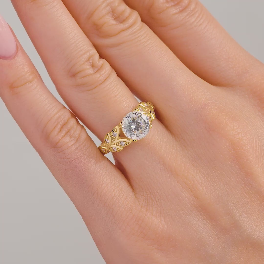 video of unique gold round cut engagement ring on model