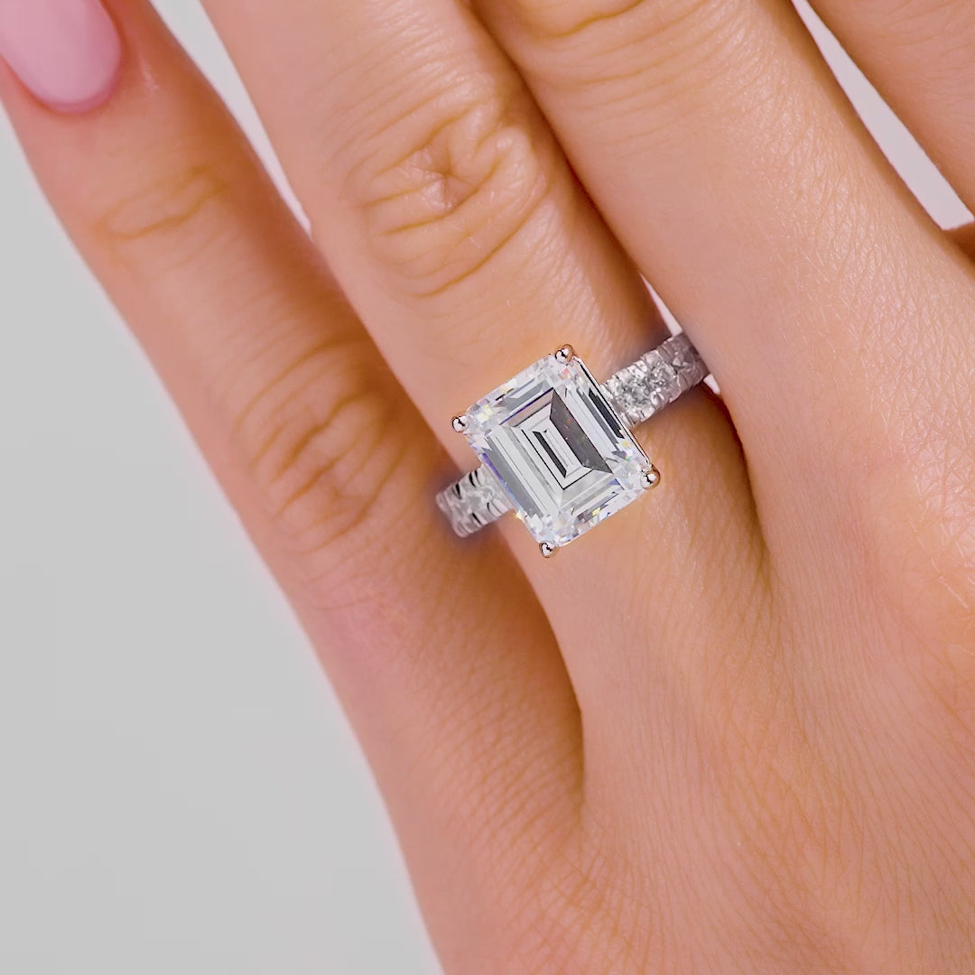 video of new silver 3.75 carat emerald cut engagement ring on model