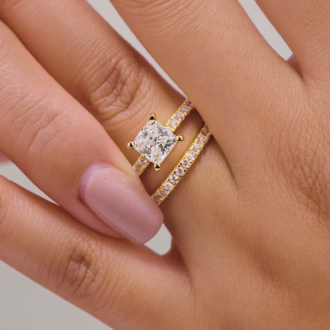 video of gold 2 carat princess cut wedding set on model