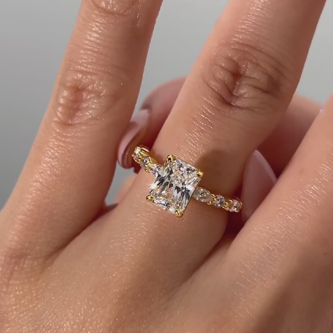 video of gold 2 pear cut vintage engagement ring on female model