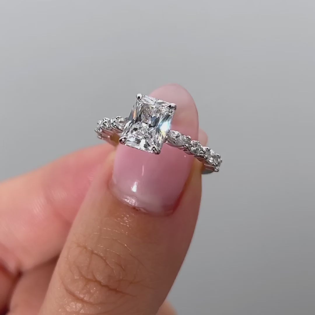video of silver 2 pear cut vintage engagement ring on female model