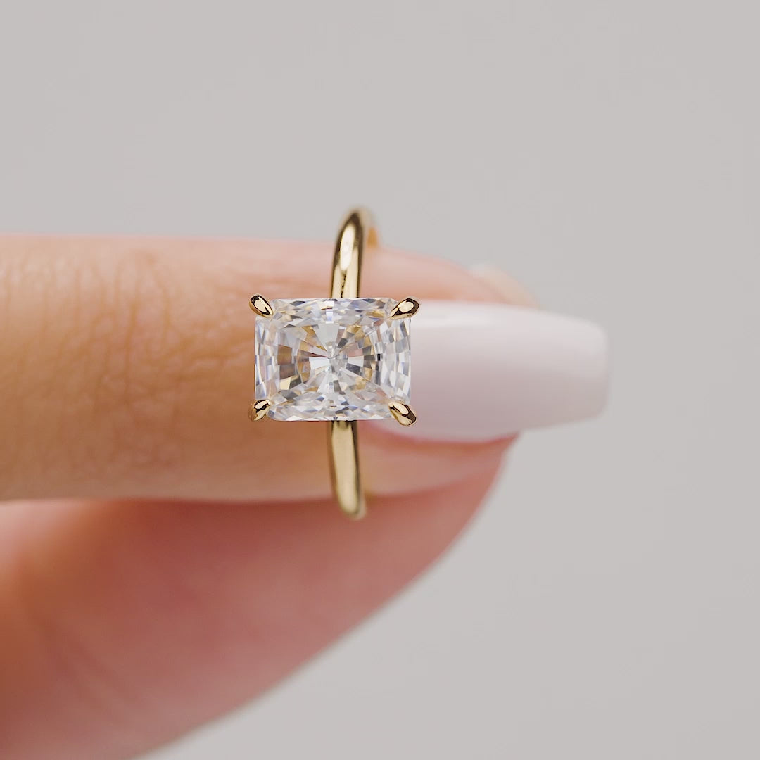 Radiant cut conflict free engagement ring in yellow gold.