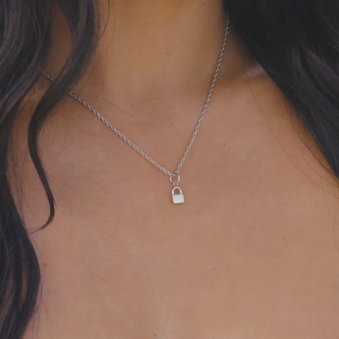 Silver Stainless Steel Lock Charm on a Singapore chain necklace worn by a model