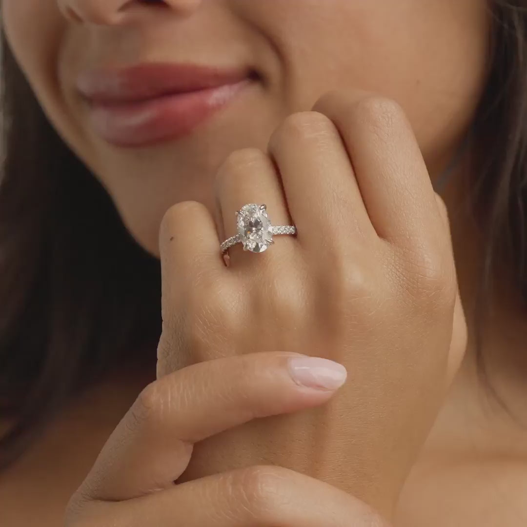 video of silver 4 carat oval cut half eternity engagement ring on model