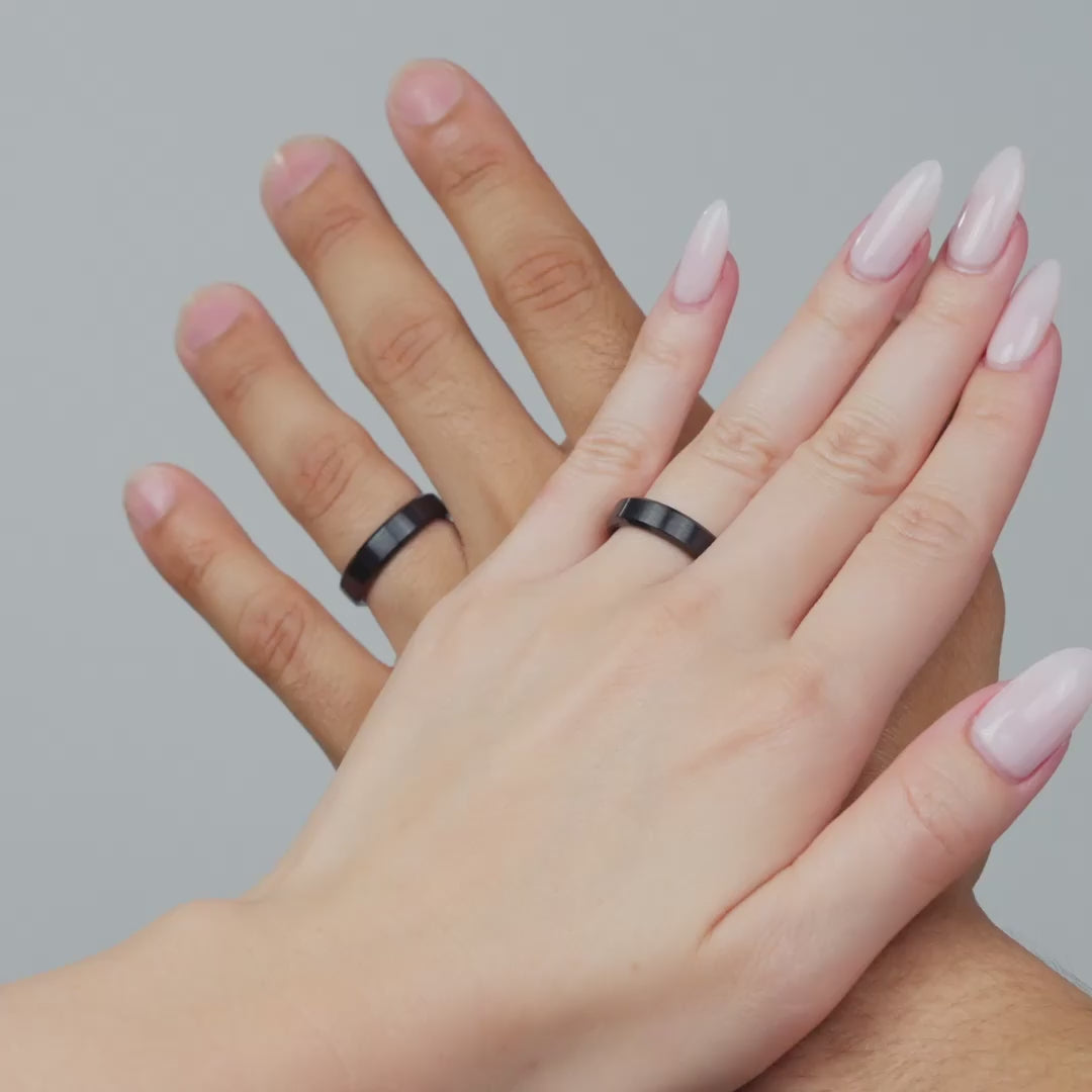 video of male and female model wearing a black slim 5mm stainless steel unisex band