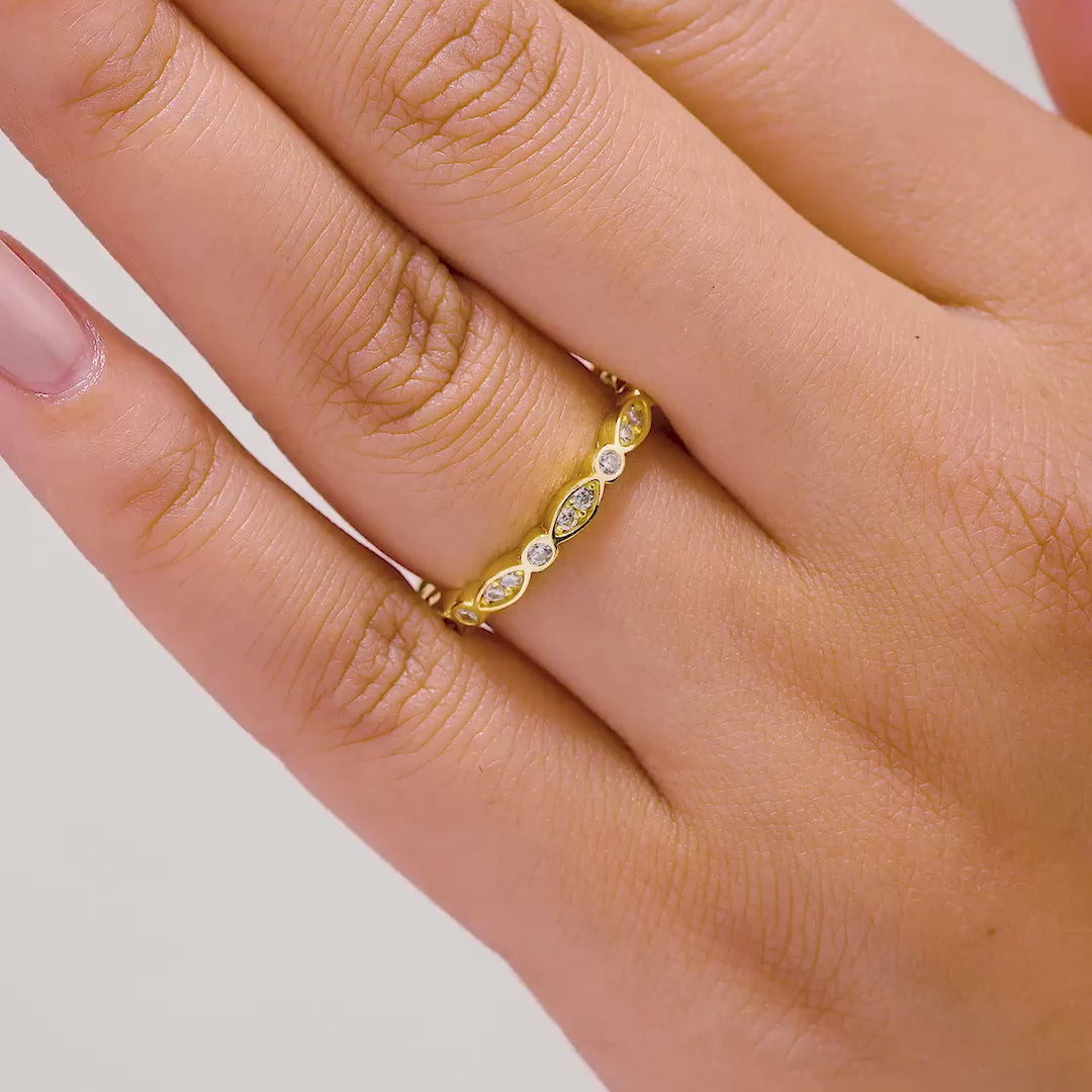 video of unique gold eternity wedding band on model