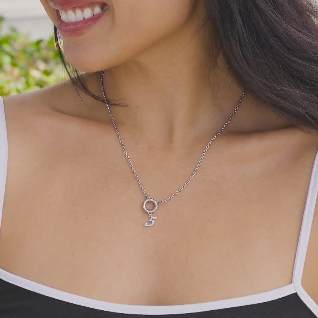 Silver stainless steel charm necklace with silver number charm "5" worn by model