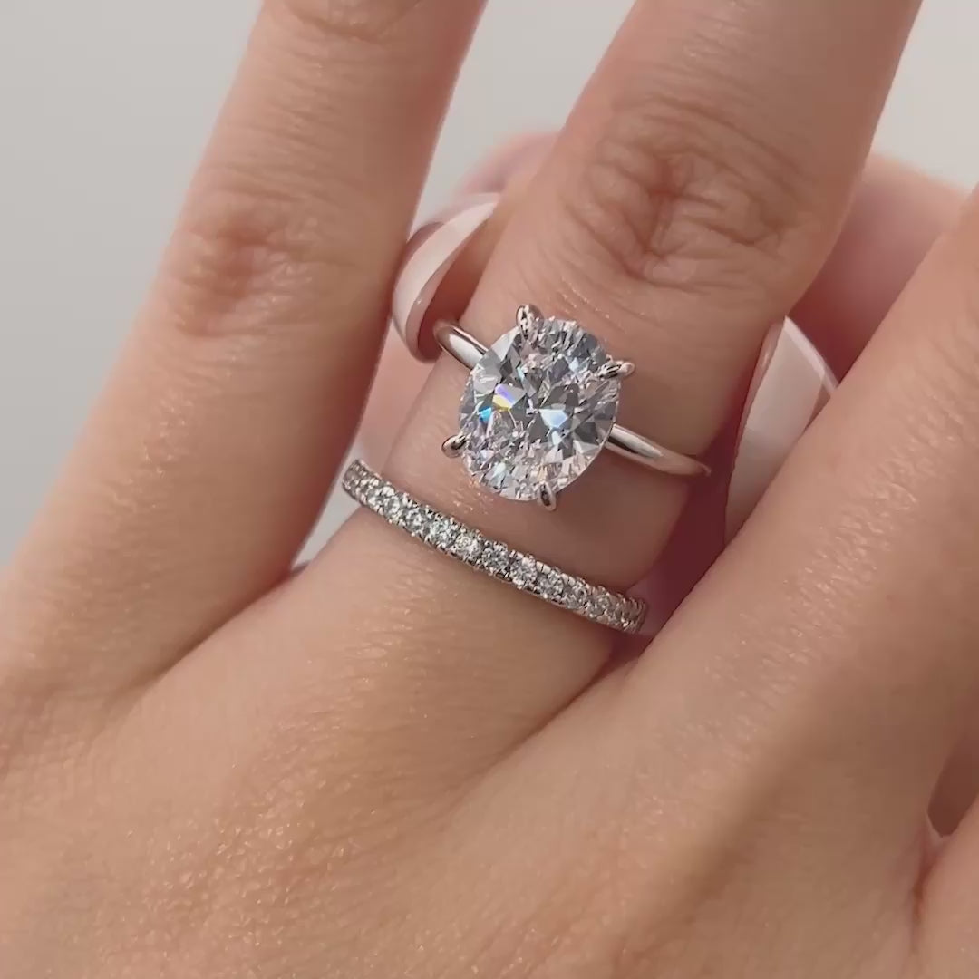 video of classic silver 3 carat oval cut wedding ring set shown on model