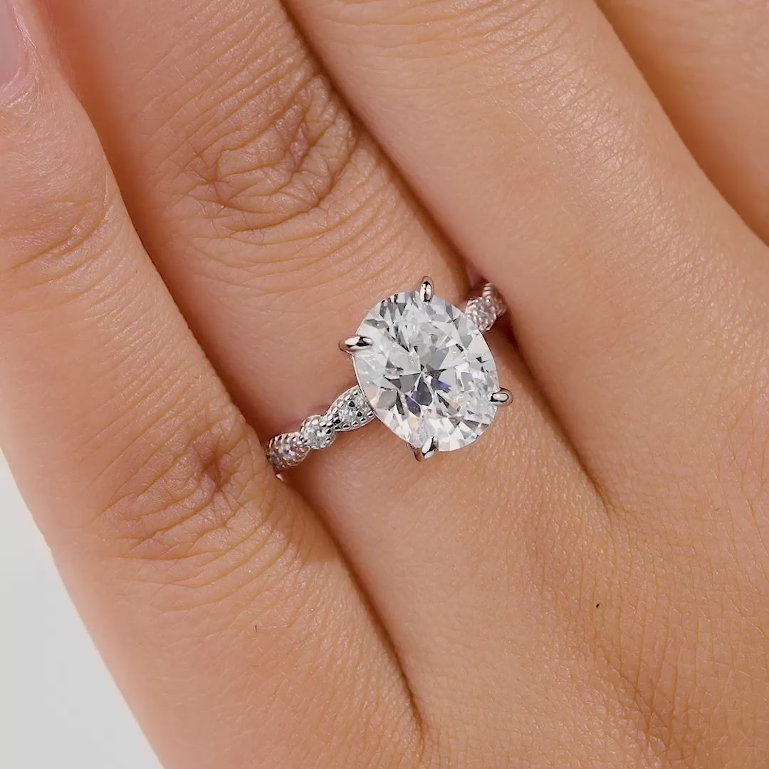 Video of silver 3 carat oval cut engagement ring on female model