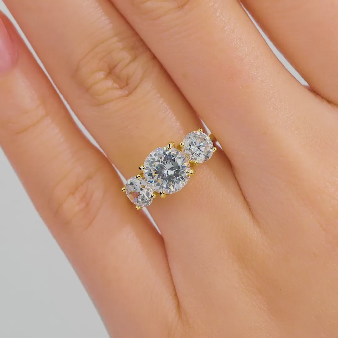 video showcasing stunning trinity 2ct gold round cut engagement ring on model's hand