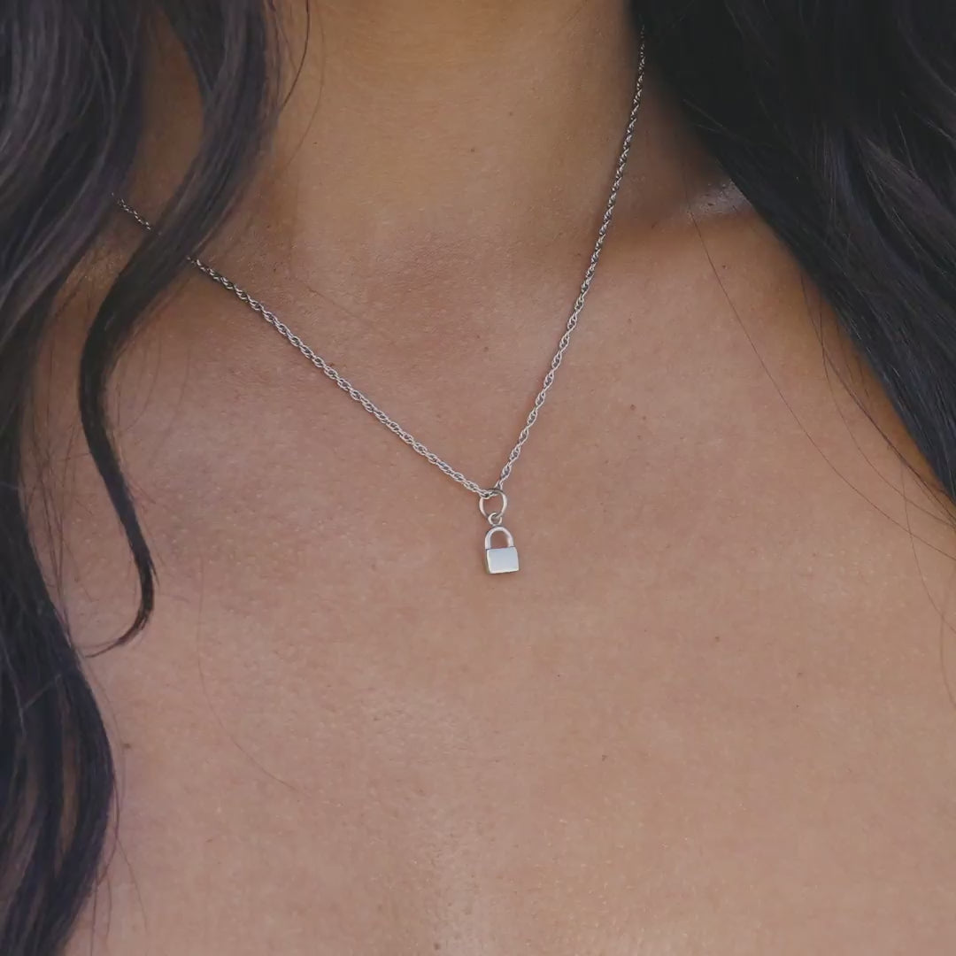 Silver Stainless Steel Lock Charm on a Singapore chain necklace worn by a model