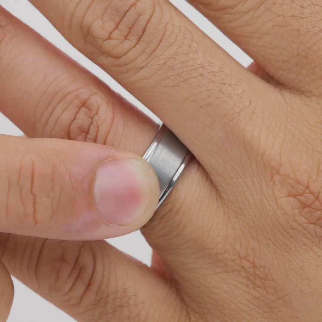 video of a silver tungsten carbide wedding band worn by model